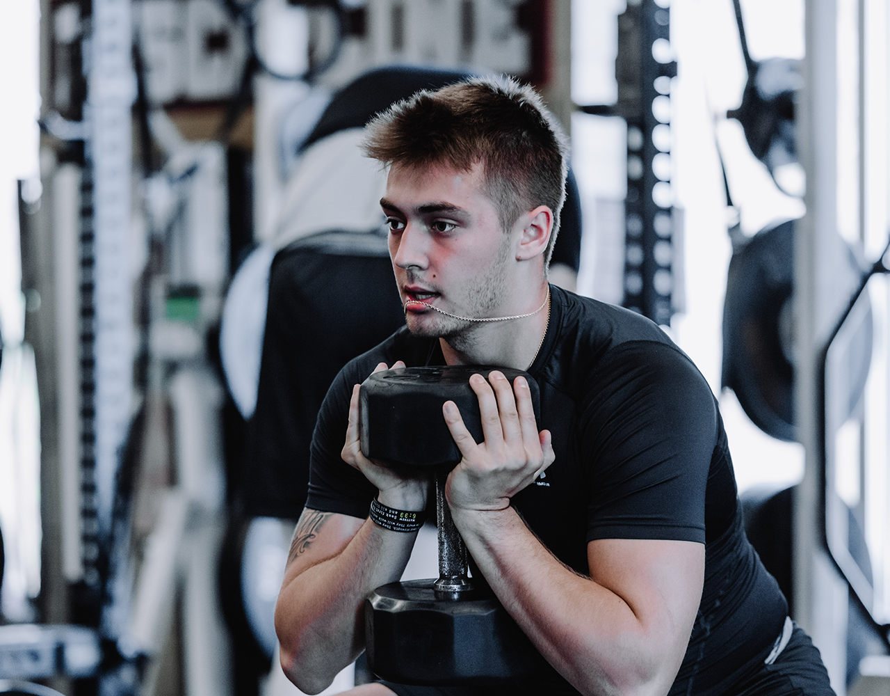 Athlete performing dumbbell goblet squat