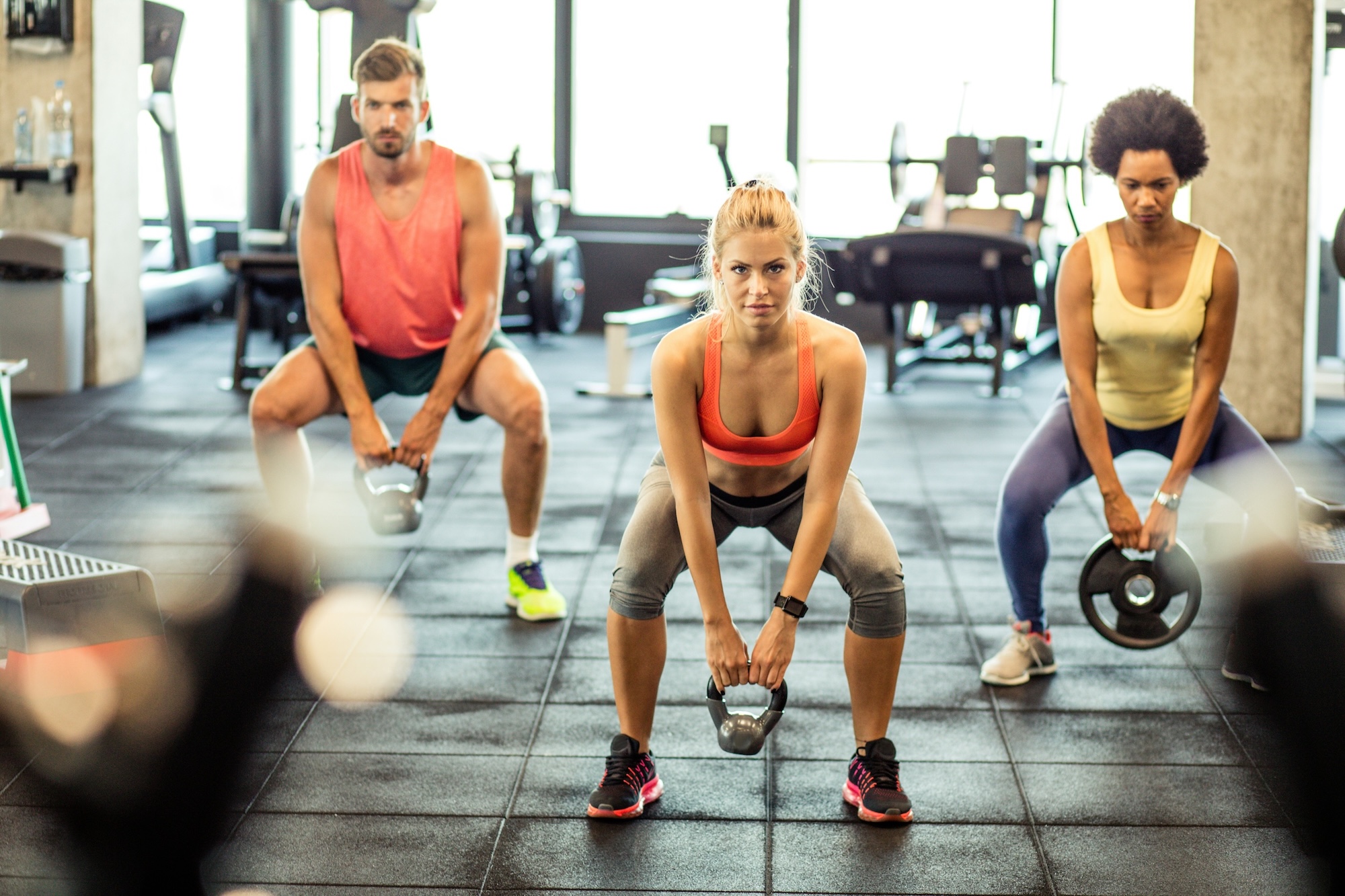 Class members holding a squat